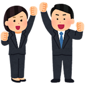 こぶしを突き上げるスーツを着た女性と男性
